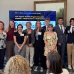 A large contingent of students, faculty and administrators from the South Carolina Governor's School of Science and Math stand in front of the display and room at the 2025 Meet the Finalists