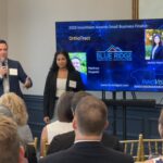 Matthew Cuppelli of Blue Ridge Surgical Innovations and OrthoTract addresses attendees at Meet the Finalists as his colleague Jackie Hanna looks on.
