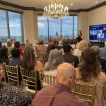 Amanda Clark of PulManage addresses attendees at Meet the Finalists