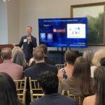 Tom Schipper of Querri addresses attendees at Meet the Finalists