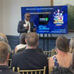 Christopher Williams of STEM U LLC addresses attendees at Meet the Finalists