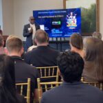 Christopher Williams of STEM U LLC addresses attendees at Meet the Finalists