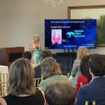 Sheryl Barbosa of Sustain Cities Network addresses attendees at Meet the Finalists