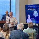 Joey Loman of SynergyMill FabLab addresses attendees at Meet the Finalists
