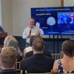 Joey Loman of SynergyMill FabLab addresses attendees at Meet the Finalists