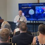 Joey Loman of SynergyMill FabLab addresses attendees at Meet the Finalists