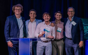 Members of the Shaw Circle team Ryan Henry, Carter Burns, Jordan Fowler and Jack Oberman stand with Joe Breen of Cantey Tech Consulting as they accept the Technology Integration award at the 2025 InnoVision Awards