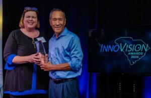 Lisa Strickland of Contec stands with Rob Cheng of PC Matic as she presents him with the Dr. Charles Townes Individual Achievement Award at the 2025 InnoVision Awards